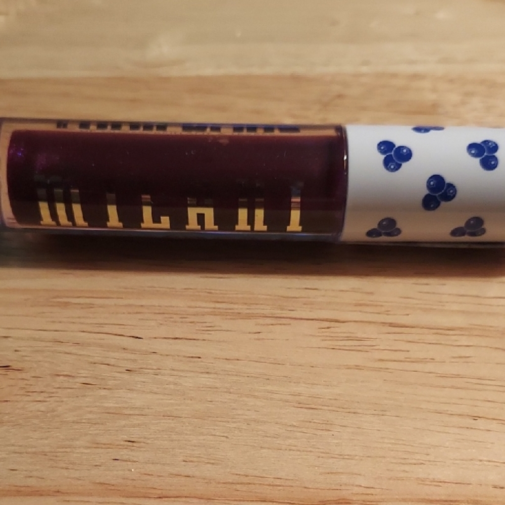 Milani Plum Lip Gloss with Blue Cap